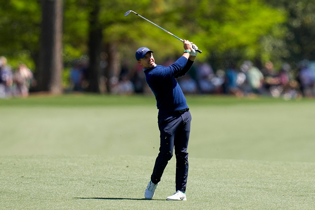 Rory McIlroy, of Northern Ireland, hits from the fairway on the 15th hole during the first round of the Masters golf tournament at the Augusta National Golf Club, Thursday, April 9, 2026, in Augusta, Ga. (AP Photo/David J. Phillip)