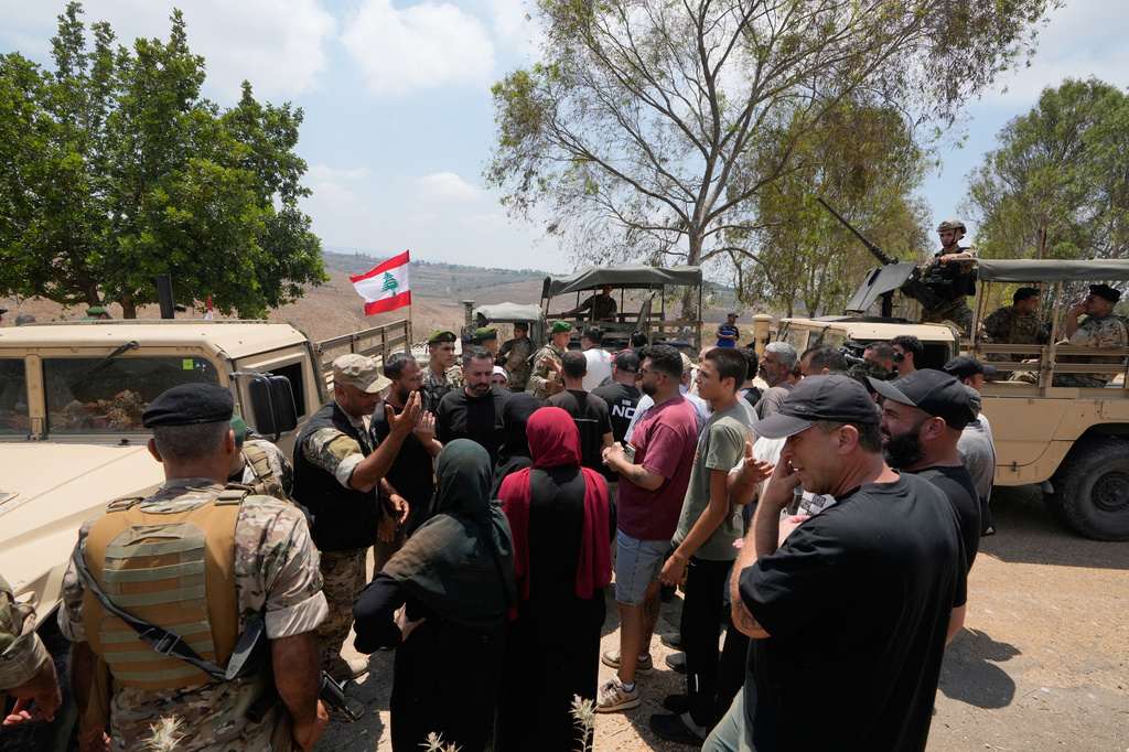 Lebanese army soldiers prevent residents from entering the southern village of Zawtar Al Gharbieh while deploying at the village entrance, Lebanon, Wednesday, July 22, 2026. (AP Photo/Mohammed Zaatari)