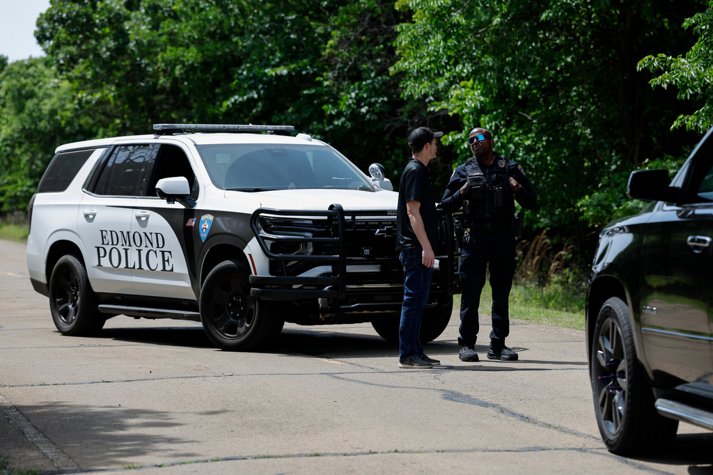 Officials block the entrance to Scissortail Campground at Arcadia Lake, Monday, May 4, 2026, in Edmond, Okla., after a shooting on Sunday evening. (AP Photo/Alonzo Adams)