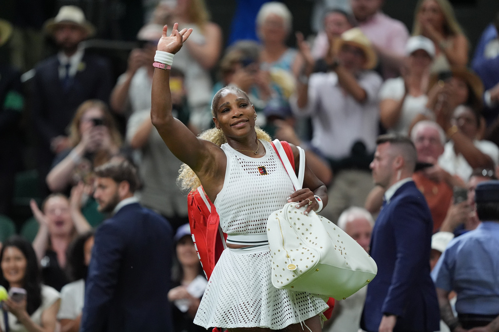 Serena Williams of the United States greets the audience as she leaves after losing to Maya Joint of Australia in their first round women's singles match at the Wimbledon Tennis Championships in London, Tuesday, June 30, 2026. (AP Photo/Maja Smiejkowska)