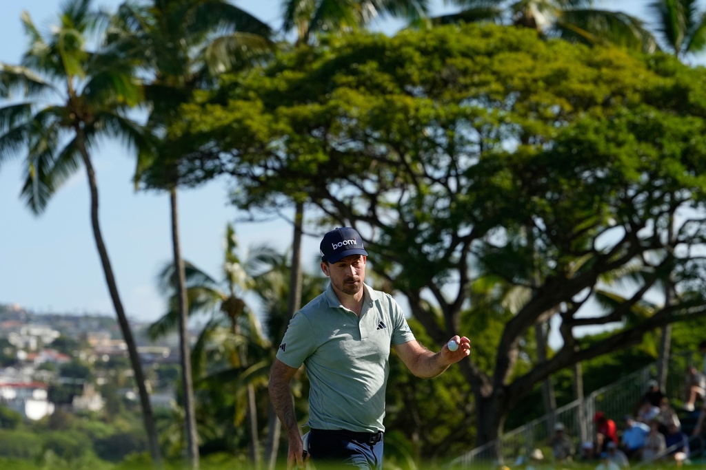 Nick Taylor, of Canada, reacts on the 18tyh hole during the first round of the Sony Open golf event at the Waialae Country Club in Honolulu, Thursday, Jan. 15, 2026. (AP Photo/Matt York)