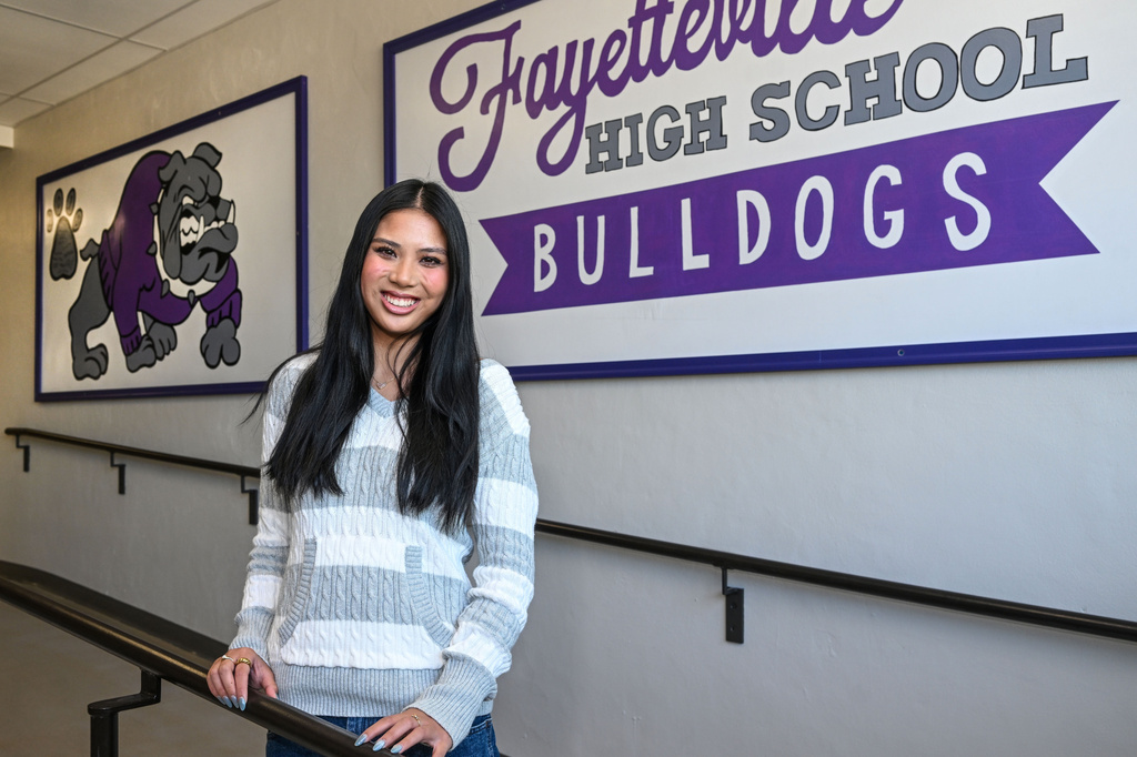 Fayetteville High senior Lily Adler, president of the Young Democrats of Arkansas, is photographed in the halls at Fayetteville High School Tuesday, April, 7, 2026 in Fayetteville, Ark. (AP Photo/Michael Woods) CORRECTION: Adler, not Alder