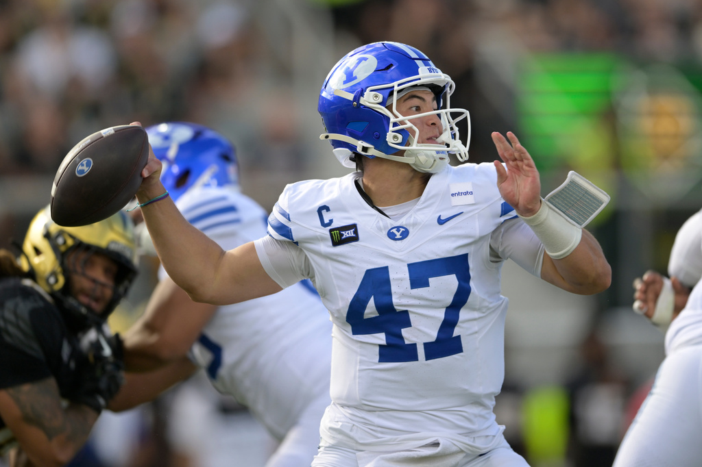 BYU quarterback Bear Bachmeier (47) throws a pass during the first half of an NCAA college football game against Central Florida, Saturday, Oct. 24, 2026, in Orlando, Fla. (AP Photo/Phelan M. Ebenhack)