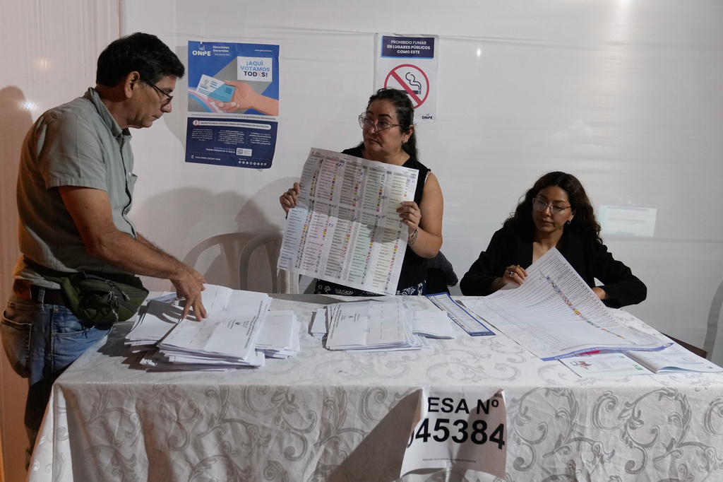 Election officials count ballots during general elections in Lima, Peru, Sunday, April 12, 2026. (AP Photo/Martin Mejia)