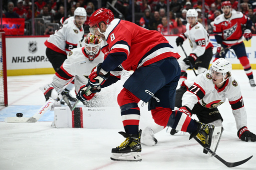 Washington Capitals left wing Alex Ovechkin (8) shoots the puck against Ottawa Senators center Ridly Greig (71) and goaltender Linus Ullmark, left, during the first period of an NHL hockey game, Saturday, Oct. 25, 2025, in Washington. (AP Photo/Nick Wass) Washington Capitals left wing Alex Ovechkin (8) shoots the puck against Ottawa Senators center Ridly Greig (71) and goaltender Linus Ullmark, left, during the first period of an NHL hockey game, Saturday, Oct. 25, 2025, in Washington. (AP Photo/Nick Wass)