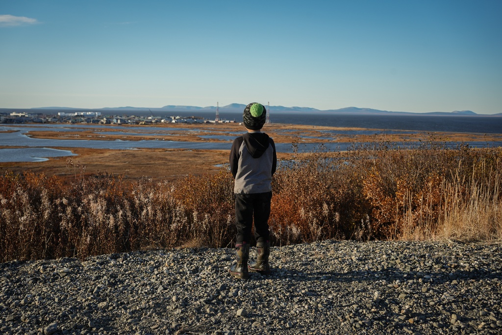 James Schaeffer, 7, looks out at a view of Kotzebue, Alaska, Friday, Sept. 26, 2025. (AP Photo/Annika Hammerschlag)
