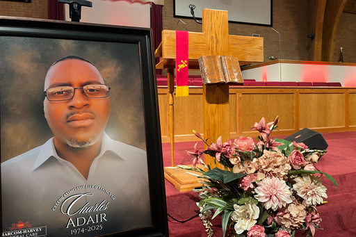 FILE - A photo of Charles Adair, a man killed when a deputy kneeled on his back in a Kansas jail, is displayed Sunday, Sept. 23, 2025, at a news conference held by his family and their attorneys at Friendship Baptist Church in Kansas City, Mo. (AP Photo/Heather Hollingsworth, File) FILE - A photo of Charles Adair, a man killed when a deputy kneeled on his back in a Kansas jail, is displayed Sunday, Sept. 23, 2025, at a news conference held by his family and their attorneys at Friendship Baptist Church in Kansas City, Mo. (AP Photo/Heather Hollingsworth, File)