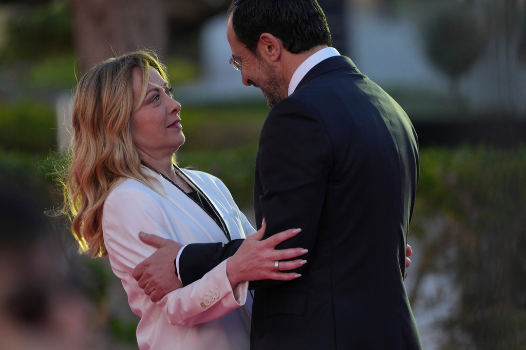 Italy's Prime Minister Giorgia Meloni, left, is welcomed by Cypriot President Nikos Christodoulides at the EU Summit in Ayia Napa, Cyprus, Thursday, April 23, 2026. (AP Photo/Petros Karadjias)