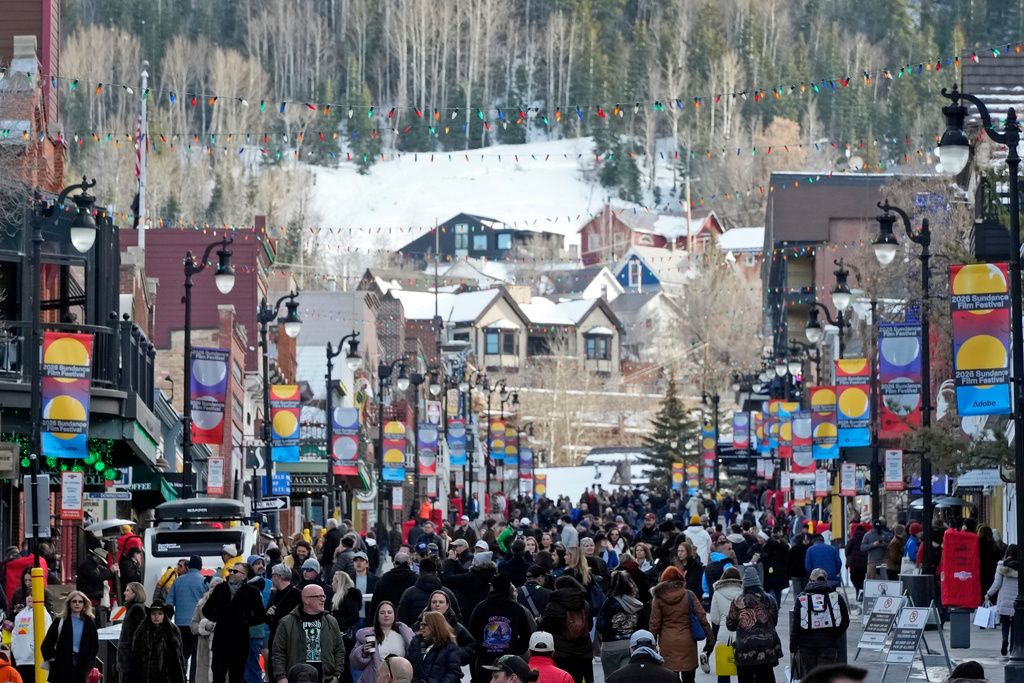 Pedestrians walk down Main Street on the first day of the 2026 Sundance Film Festival on Thursday, Jan. 22, 2026, in Park City, Utah. (Photo by Charles Sykes/Invision/AP)