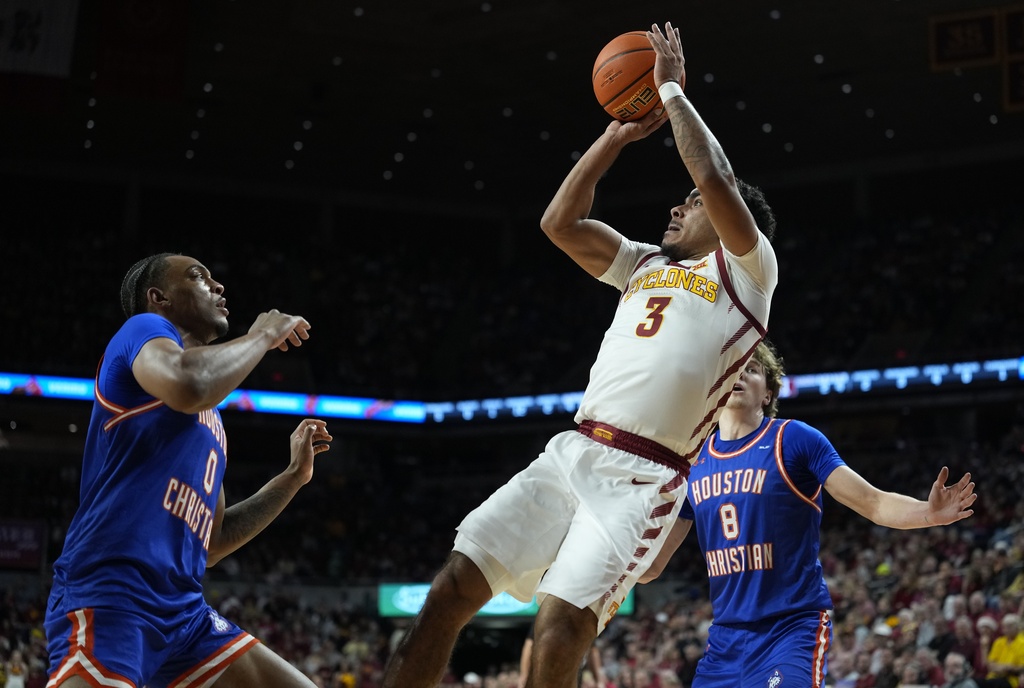 Iowa State guard Tamin Lipsey (3) looks to shoot over Houston Christian guard Demari Williams (0) during the first half of an NCAA college basketball game, Monday, Dec. 29, 2025, in Ames, Iowa. (AP Photo/Matthew Putney)