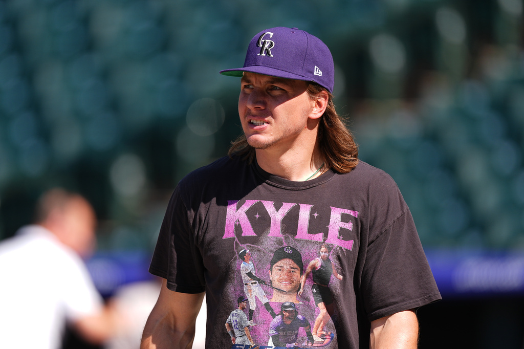 Colorado Rockies left fielder Jake McCarthy looks on before a baseball game against the Kansas City Royals, Saturday, Aug. 1, 2026, in Denver. (AP Photo/David Zalubowski)