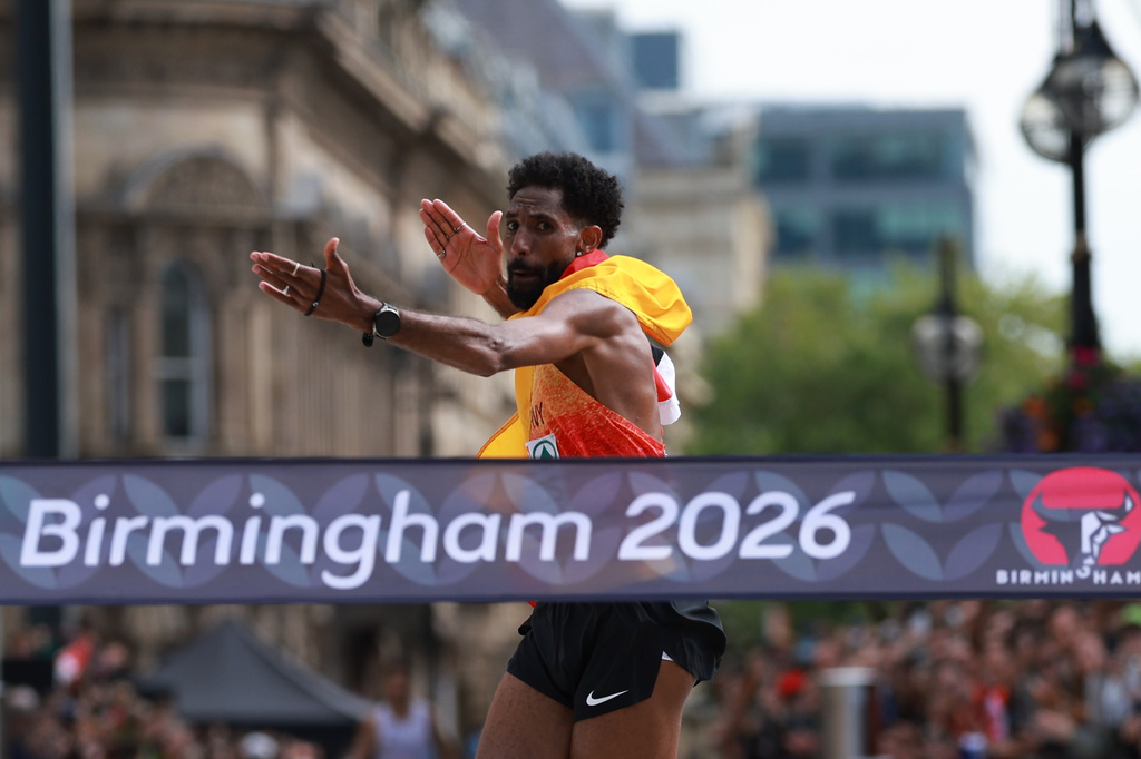 Amanal Petros of Germany reacts as he is about to cross the finish line to win the men's marathon at the European Athletics Championships in Birmingham, England, Sunday, Aug. 16, 2026. (AP Photo/Morgan Harlow)
