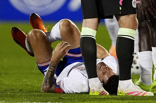 United States forward Christian Pulisic reacts after being injured against Australia in the first half of an international friendly soccer match Tuesday, Oct. 14, 2025, in Commerce City, Colo. (AP Photo/David Zalubowski) United States forward Christian Pulisic reacts after being injured against Australia in the first half of an international friendly soccer match Tuesday, Oct. 14, 2025, in Commerce City, Colo. (AP Photo/David Zalubowski)