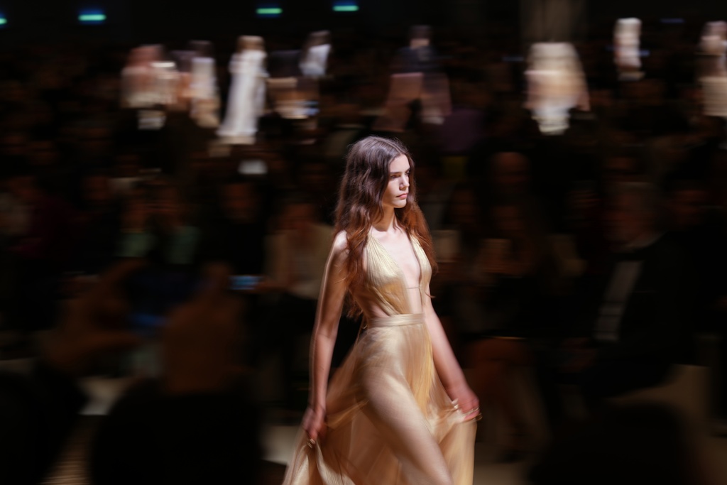 A model wears a creation as part of the Roberto Cavalli Spring/Summer 2026 collection presented in, in Milan, Thursday, Sept. 25, 2025. (AP Photo/Antonio Calanni)