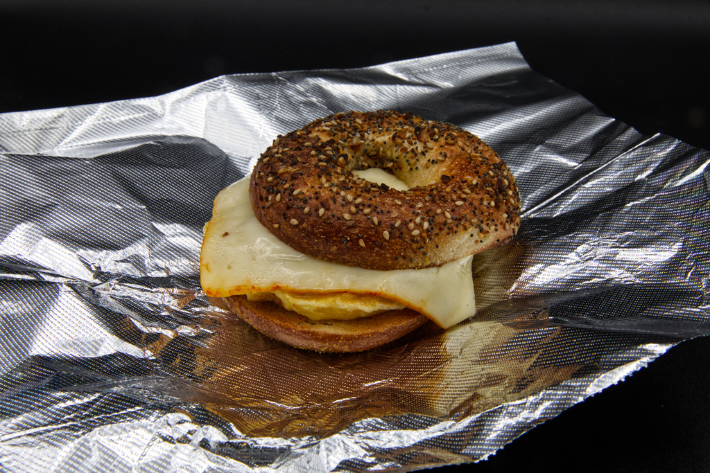 A breakfast egg and cheese on an "everything" bagel photographed in Phoenix, Ariz., Tuesday, July 21, 2026. (AP Photo/Dario Lopez-Mills)