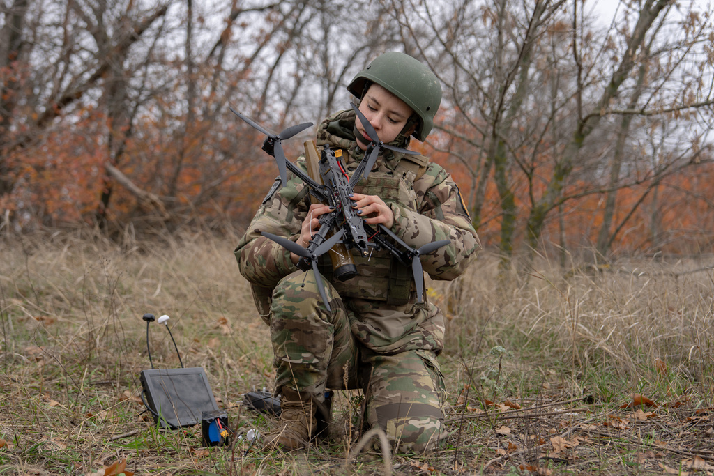 Monka, an FPV drone operator from the third assault brigade, assembles an FPV drone during a demonstration for The Associated Press, Wednesday, Nov. 5, 2025, in Kharkiv Oblast, Ukraine. (AP Photo/Julia Demaree Nikhinson)