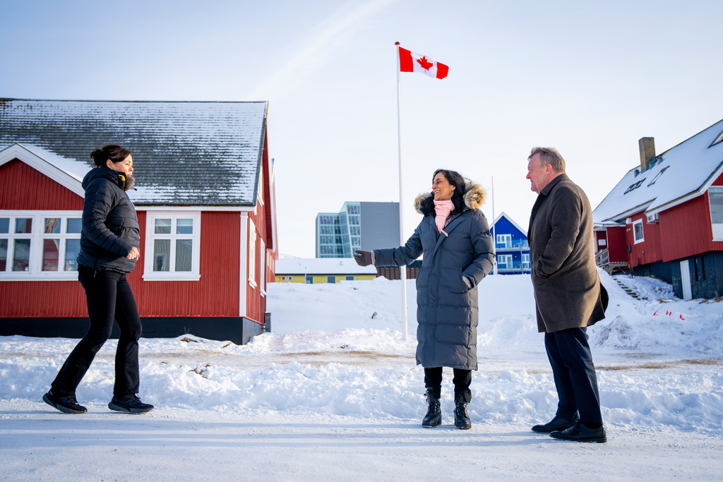 Greenland's Minister for Foreign Affairs Vivian Motzfeldt, left, Canada's Foreign Minister Anita Anand, and Danish Foreign Minister Lars Loekke Rasmussen, right, meet in front of the newly opened Canadian consulate in Nuuk, Saturday, Feb. 7, 2026. (Ida Marie Odgaard/Ritzau Scanpix via AP)