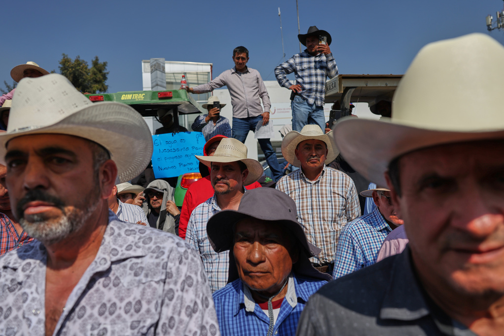 Farmers protest a proposed water law outside the Chamber of Deputies in Mexico City, Wednesday, Dec. 3, 2025. (AP Photo/Claudia Rosel)