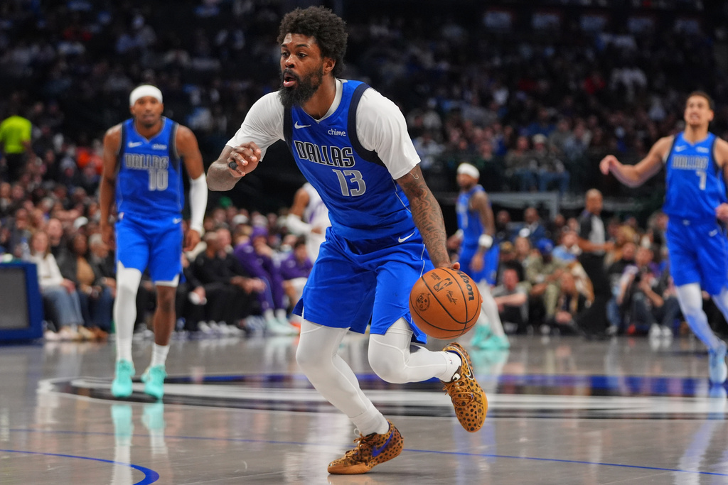 Dallas Mavericks forward Naji Marshall (13) dribbles during the second half of an NBA basketball game against the Utah Jazz in Dallas, Thursday, Jan. 15, 2026. (AP Photo/LM Otero)