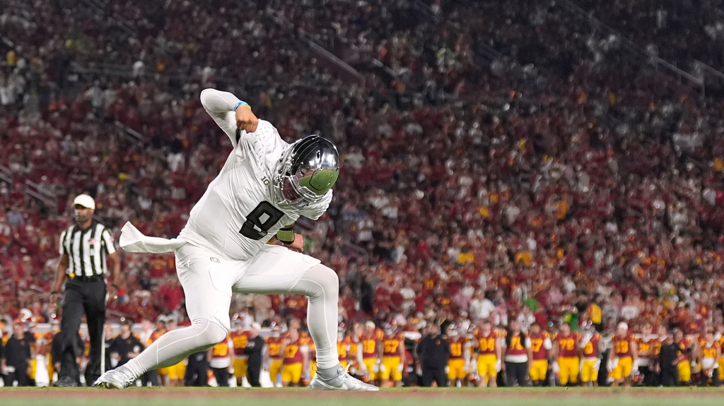 Oregon quarterback Dylan Raiola celebrates a touchdown during the second half of an NCAA college football game against Southern California, Saturday, Sept. 26, 2026, in Los Angeles. (AP Photo/Mark J. Terrill)
