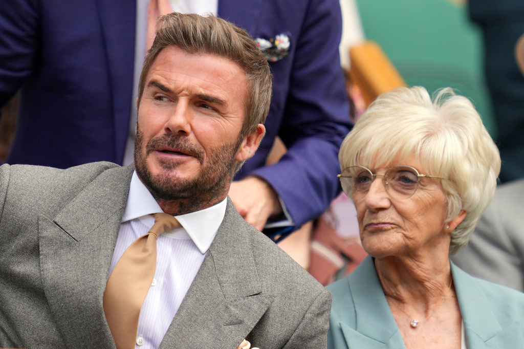 Soccer legend David Beckham sits with his mother Sandra Georgina Beckham in the royal box during the men's singles match between Jannik Sinner of Italy and Miomir Kecmanovic of Serbia at the Wimbledon Tennis Championships in London, Monday, June 29, 2026.(AP Photo/Kin Cheung)