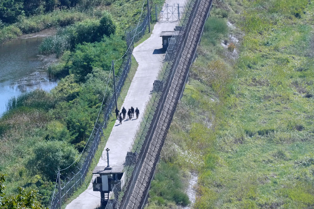 South Korean army soldiers patrol along the barbed-wire fence near the border with North Korea, in Paju, South Korea, Tuesday, Sept. 29, 2026. (AP Photo/Ahn Young-joon)