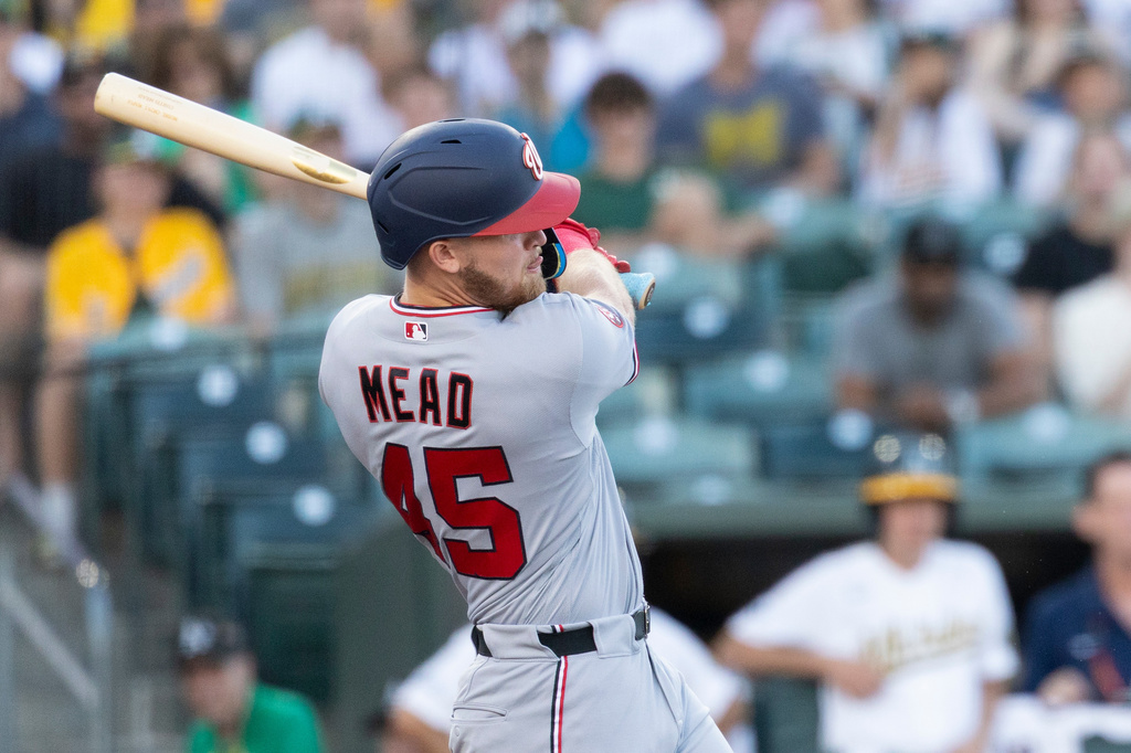 Washington Nationals' Curtis Mead hits a two RBI double during the third inning of a baseball game against the Athletics Friday, July 17, 2026, in West Sacramento, Calif. (AP Photo/Sara Nevis)