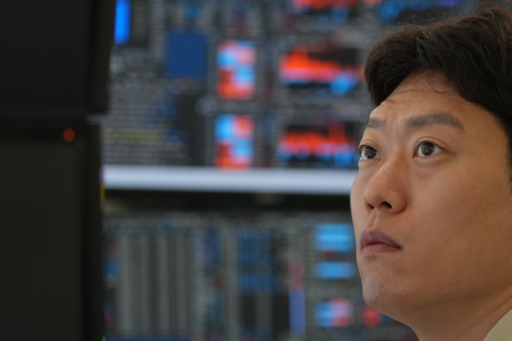 A dealer watches computer monitors at a dealing room of Hana Bank in Seoul, South Korea, Thursday, July 2, 2026. (AP Photo/Lee Jin-man)