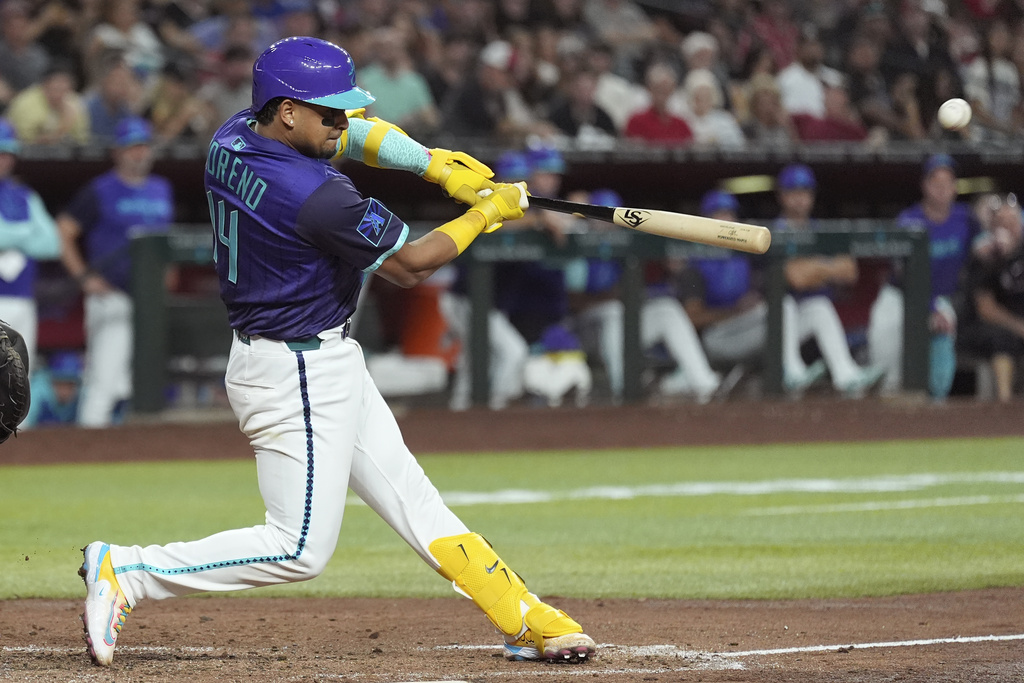 Arizona Diamondbacks' Gabriel Moreno connects for a three-run home run against the Cincinnati Reds during the third inning of a baseball game Friday, Aug. 22, 2025, in Phoenix. (AP Photo/Ross D. Franklin)