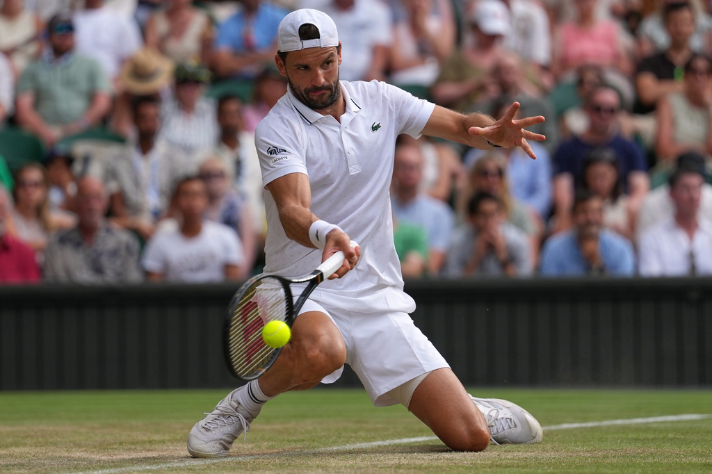 Grigor Dimitrov of Bulgaria plays a return during the men's singles fourth round match against Arthur Fery of Britain at the Wimbledon Tennis Championships in London, Monday, July 6, 2026.(AP Photo/Kirsty Wigglesworth)