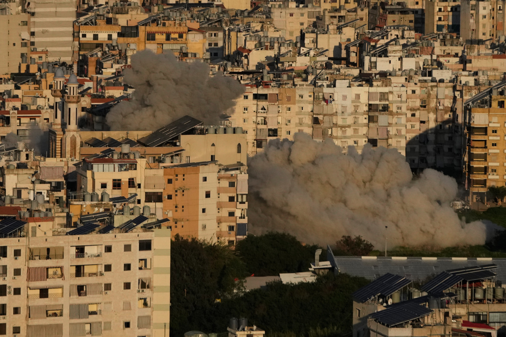Smoke rises from Israeli airstrikes in Dahiyeh, a southern suburb of Beirut, Lebanon, Tuesday, March 3, 2026. (AP Photo/Hussein Malla)