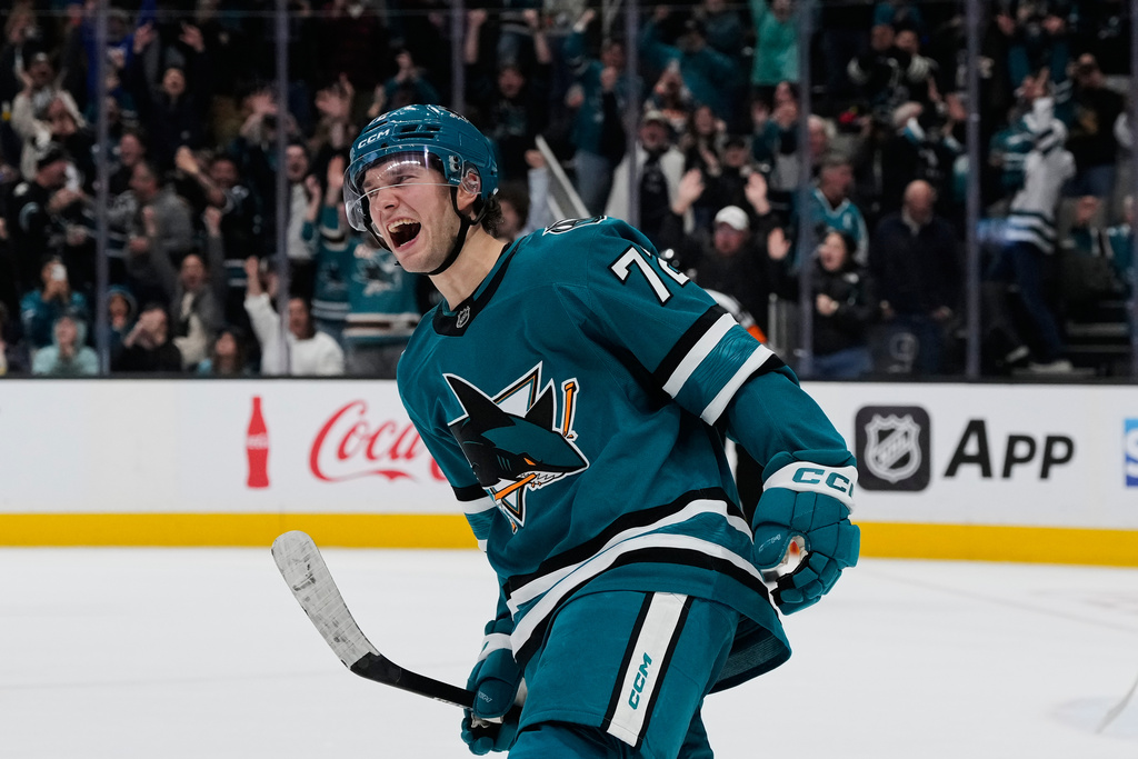 San Jose Sharks left wing William Eklund, left, celebrates after scoring a goal in the shoot-out of an NHL hockey game against the Minnesota Wild, Wednesday, Dec. 31, 2025, in San Jose, Calif. (AP Photo/Godofredo A. Vásquez)
