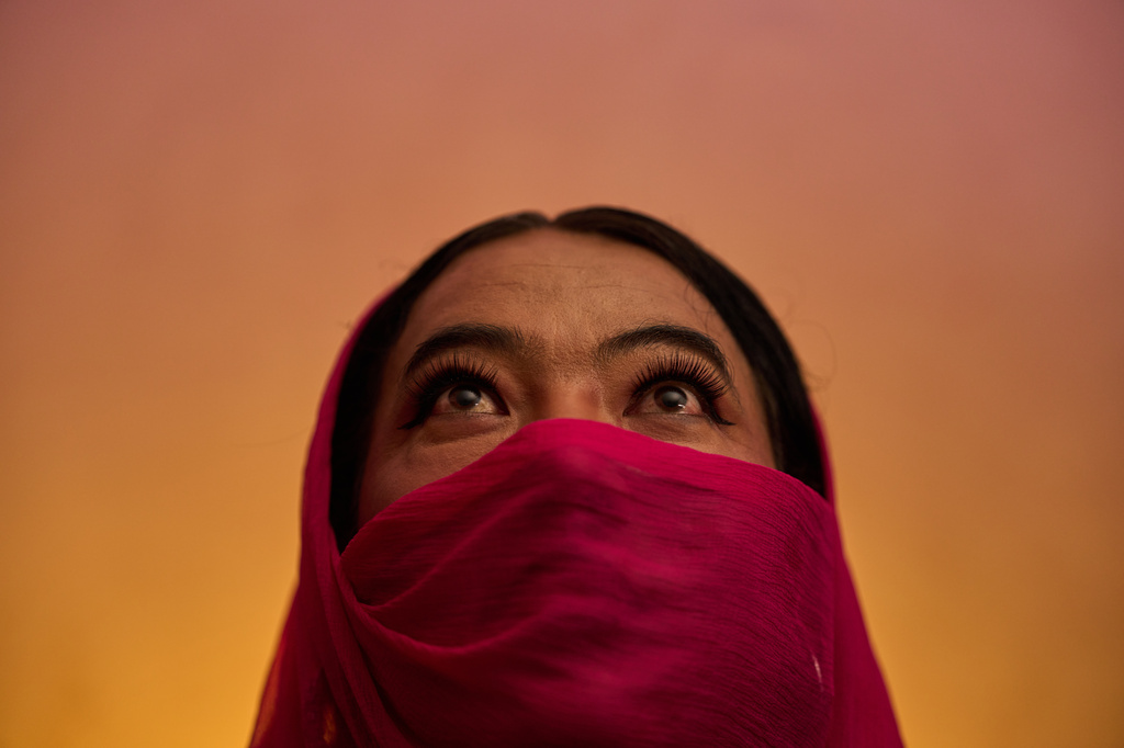 Barsha Magar, a former aid worker who turned to sex work to survive after losing her job amid the U.S. foreign aid cuts, poses for a photo, Sunday, May 17, 2026, in Hetauda, Nepal. Magar spent 16 years as an HIV outreach worker and peer educator for the NGO Friends Hetauda before turning in desperation to sex work, where she has been raped at gunpoint. (AP Photo/Bram Janssen)