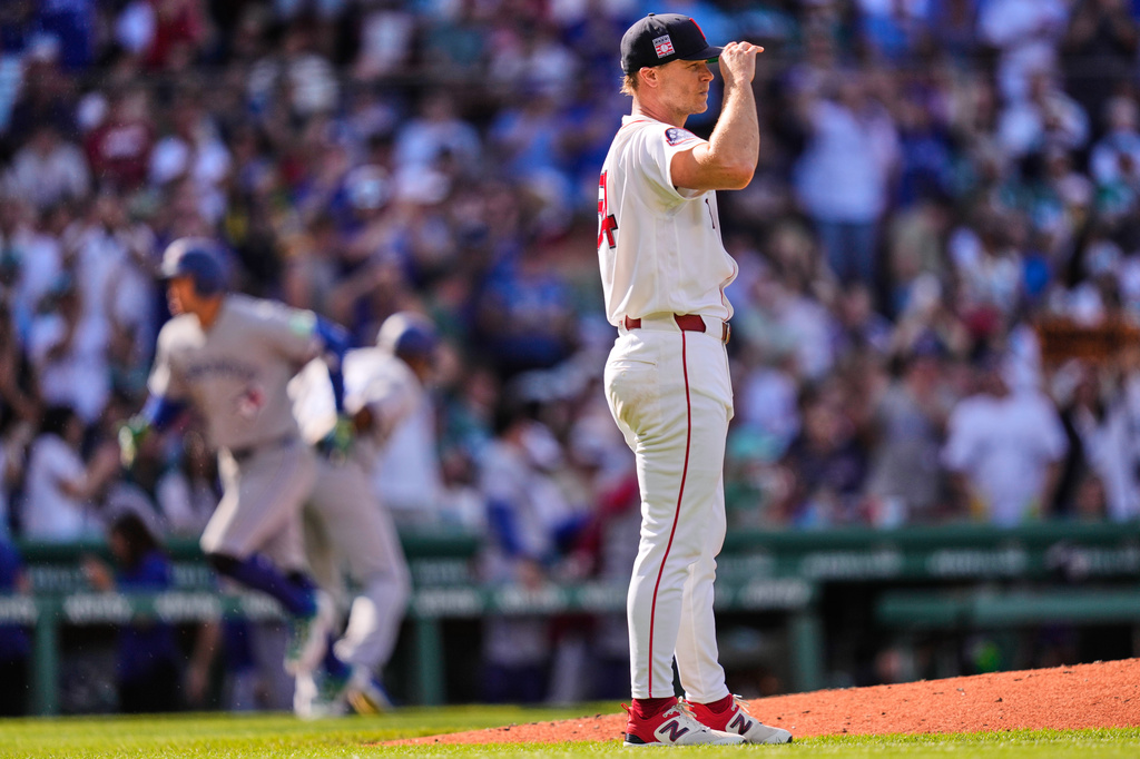 Boston Red Sox's Sonny Gray waits for Toronto Blue Jays' George Springer to round the bases on a three-run home run during the third inning of a baseball game, Saturday, July 25, 2026, in Boston. (AP Photo/Charles Krupa)