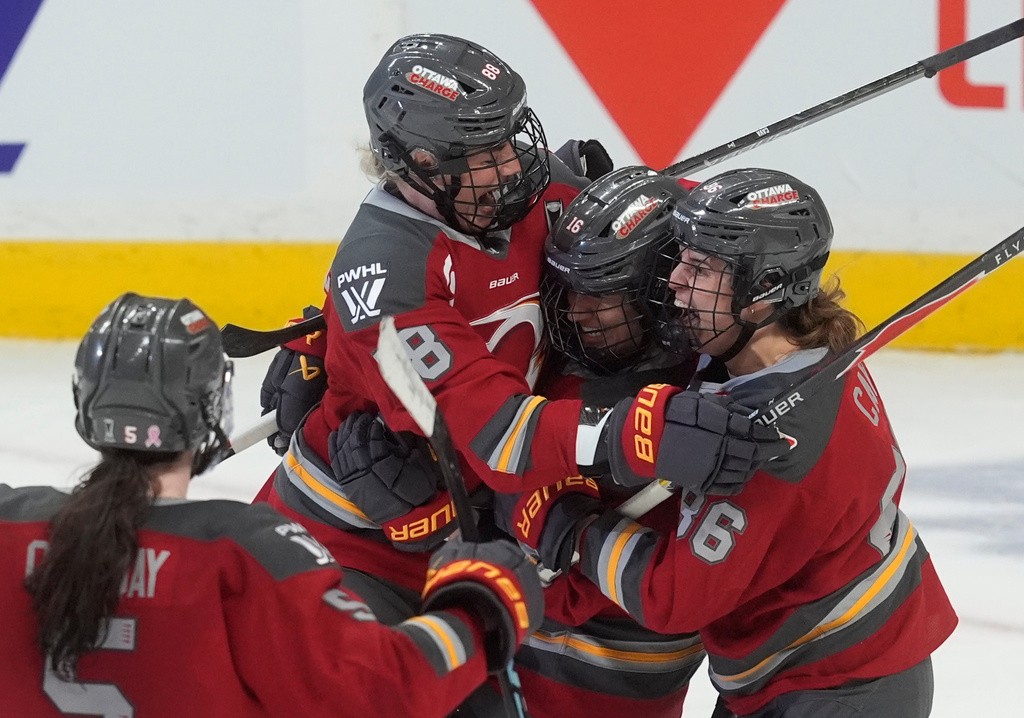 Ottawa Charge's Ronja Savolainen (88) celebrates with teammates after her goal against the Boston Fleet during third-period PWHL hockey playoff action in Ottawa, Ontario, Friday, May 8, 2026. (Adrian Wyld/The Canadian Press via AP)