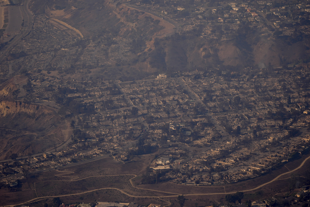 The devastation from the Palisades Fire is seen from the air in the Pacific Palisades neighborhood of Los Angeles, Thursday, Jan. 9, 2025. (AP Photo/Mark J. Terrill)