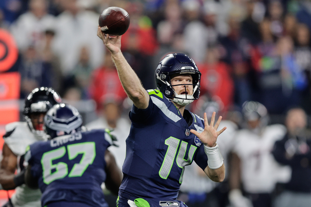 Seattle Seahawks quarterback Sam Darnold throws a pass during an NFL football game against the Houston Texans Monday, Oct. 20, 2025, in Seattle. (AP Photo/John Froschauer)