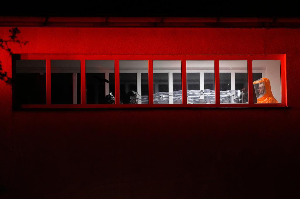 A U.S. doctor, who was in contact with people infected with Ebola in Uganda, arrives in a hospital in Prague, Czech Republic, Thursday, May 21, 2026. (AP Photo/Petr David Josek)