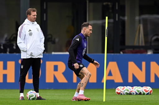 Germany's head coach Julian Nagelsmann, left, and player david Raum attend a training session of the German national soccer team in Herzogenaurach, Germany, Tuesday, Oct. 7, 2025, ahead of the World Cup qualifier soccer match against Luxembourg. (Federico Gambarini/dpa via AP) Germany's head coach Julian Nagelsmann, left, and player david Raum attend a training session of the German national soccer team in Herzogenaurach, Germany, Tuesday, Oct. 7, 2025, ahead of the World Cup qualifier soccer match against Luxembourg. (Federico Gambarini/dpa via AP)