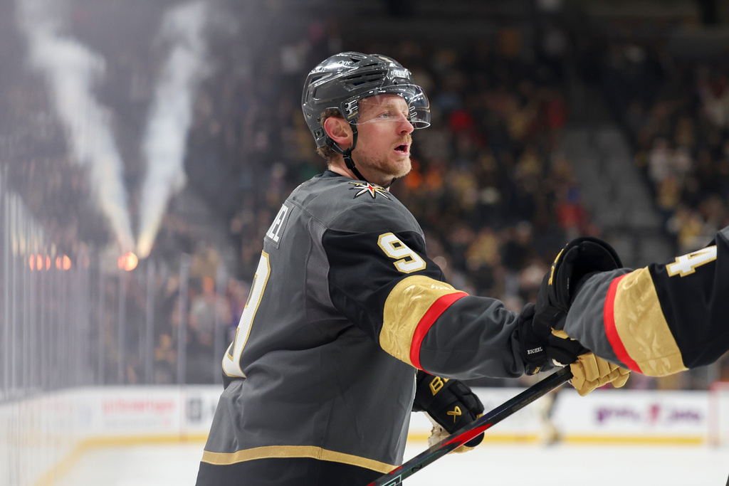 Vegas Golden Knights center Jack Eichel (9) reacts after scoring a goal against the Vancouver Canucks during the second period of an NHL hockey game Wednesday, Feb. 4, 2026, in Las Vegas. (AP Photo/Ian Maule)