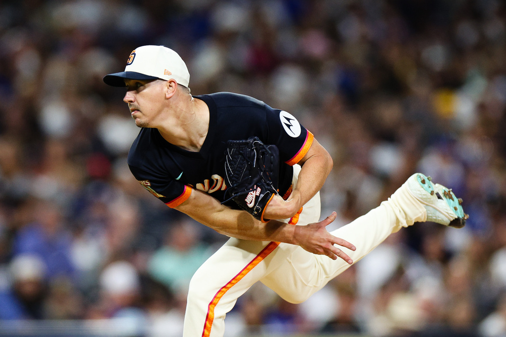 '"San Diego Padres' Walker Buehler follows through on a pitch against the Los Angeles Dodgers in the sixth inning of a baseball game Friday, June 26, 2026, in San Diego. (AP Photo/Derrick Tuskan)