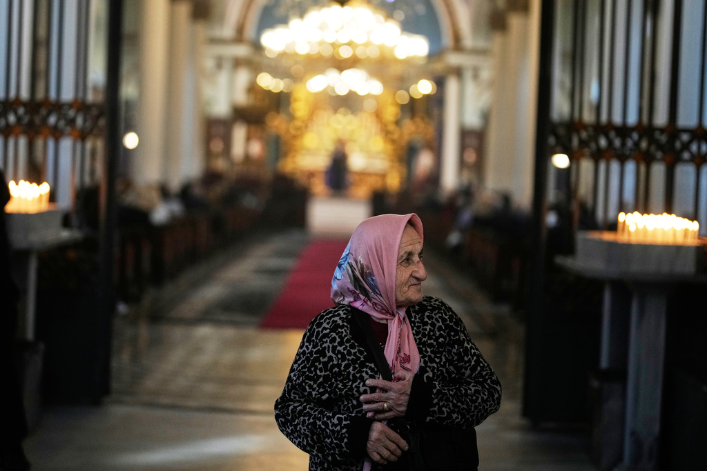 Armenian worshippers pray during Sunday Mass at the Surp Asdvadzadzin Patriarchal Church in Istanbul, Turkey, Sunday, Nov. 23, 2025, ahead of the visit of Pope Leo XIV to Turkey. (AP Photo/Khalil Hamra)