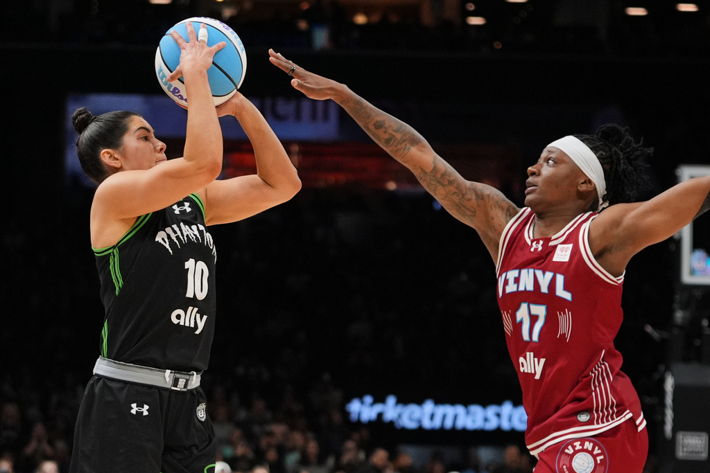 Phantom BC guard Kelsey Plum (10) shoots over Vinyl BC guard Erica Wheeler (17) during the second half of a semifinal in their Unrivaled 3-on-3 basketball game, Monday, March 2, 2026, in New York. (AP Photo/Frank Franklin II)