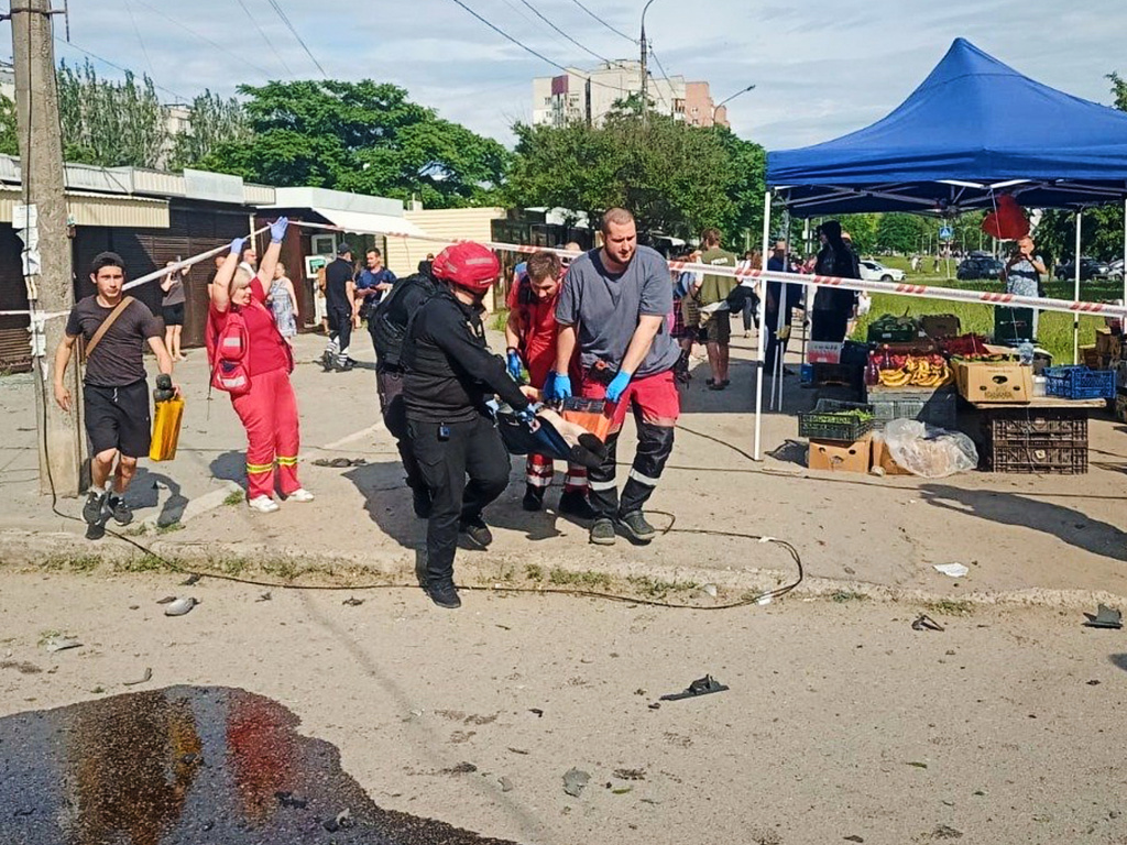 In this photo provided by the Head of Regional Military Administration Ivan Fedorov, paramedics carry an injured person after a Russian strike in Zaporizhzhia, Ukraine, Monday, June 8, 2026. (Telegram Channel of Head of Zaporizhzhia Regional Military Administration Ivan Fedorov via AP)