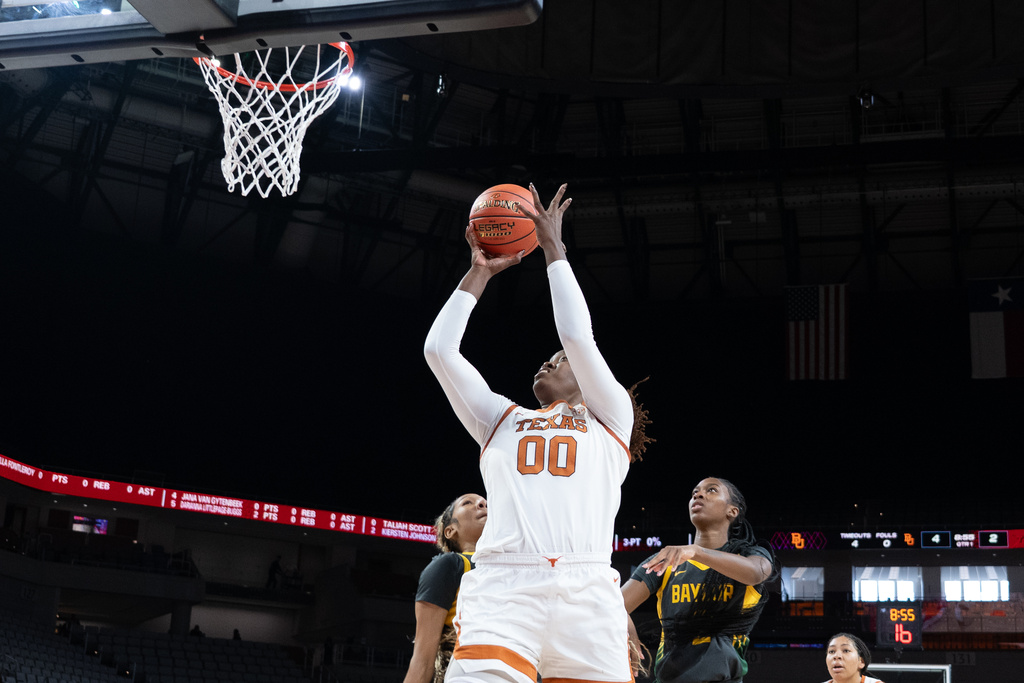 Texas center Kyla Oldacre (00) shoots during an NCAA college basketball game against Baylor, Sunday, Dec. 14, 2025, Fort Worth, Texas. (AP Photo/Jessica Tobias)
