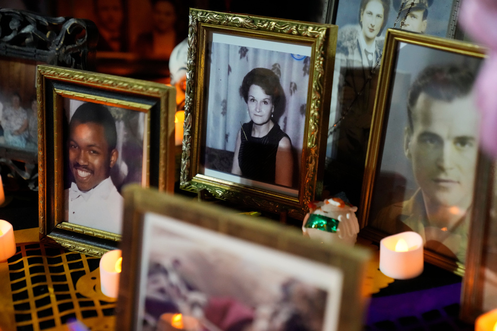 Photographs are part of a Día de Muertos ofrenda displayed at an event at the National Museum of Mexican Art, Saturday, Oct. 25, 2025, in Chicago. (AP Photo/Erin Hooley)