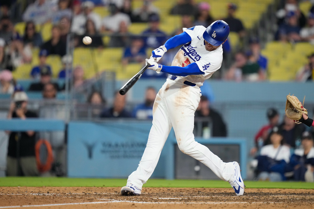 Los Angeles Dodgers' Freddie Freeman hits a solo walk-off home run during the ninth inning of a baseball game against the Los Angeles Angels, Friday, June 5, 2026, in Los Angeles. (AP Photo/Mark J. Terrill)