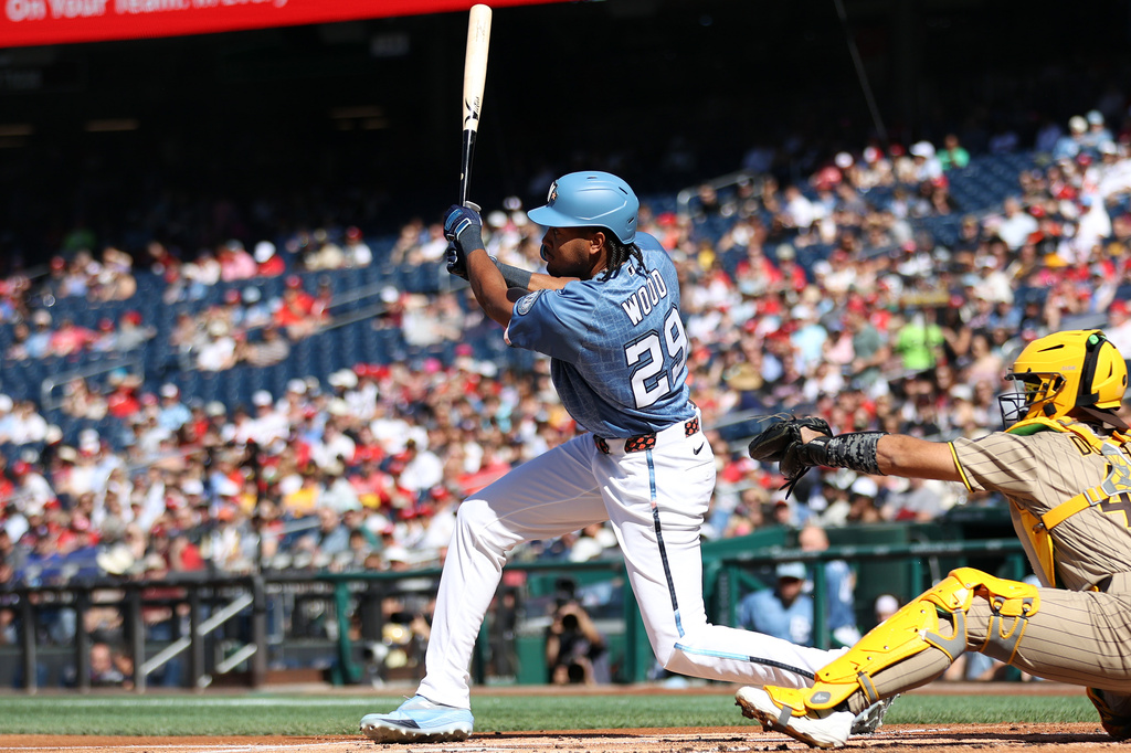 Washington Nationals' James Wood singles during the first inning of a baseball game against the San Diego Padres, Saturday, May 30, 2026, in Washington. (AP Photo/Daniel Kucin Jr.)