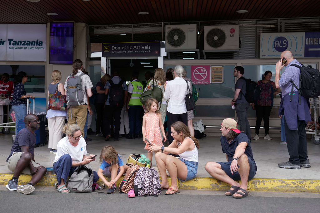 Passengers wait for their delayed flights at Jomo Kenyatta International Airport (JKIA) in Nairobi, Kenya, Monday, Feb. 16, 2026. (AP Photo/Brian Inganga)