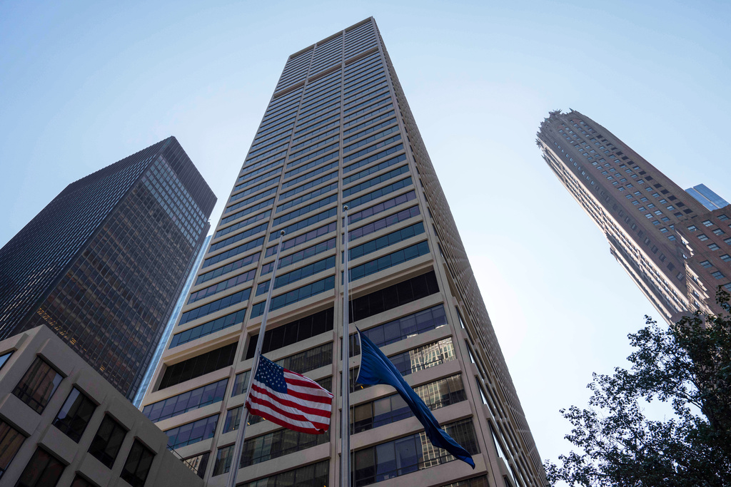 FILE - Flags fly on the exterior of 345 Park Ave on July 29, 2025, in New York. (AP Photo/Yuki Iwamura, File)